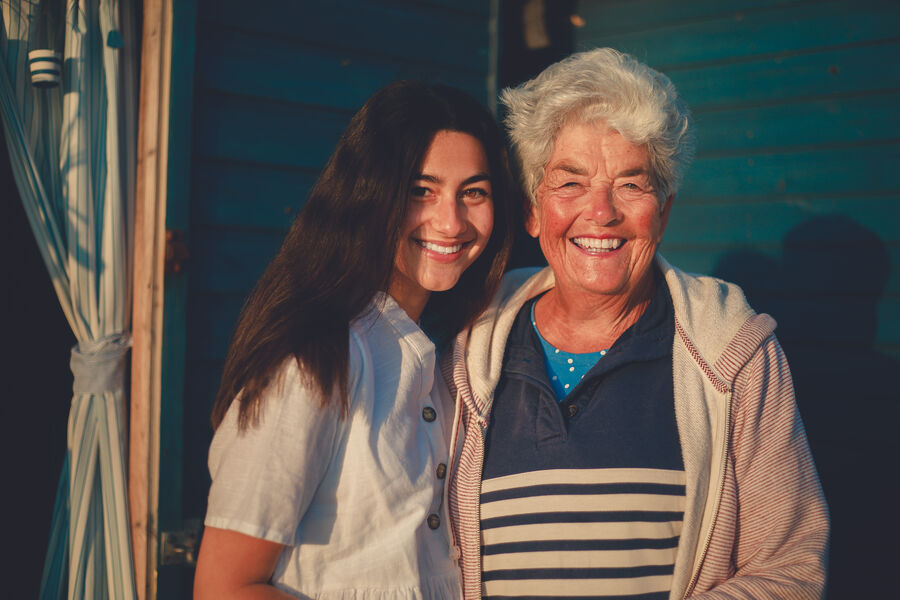 Two people laughing together on a shoot day