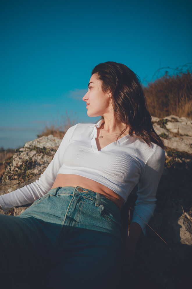 A model on a coastal location shoot for the portfolio